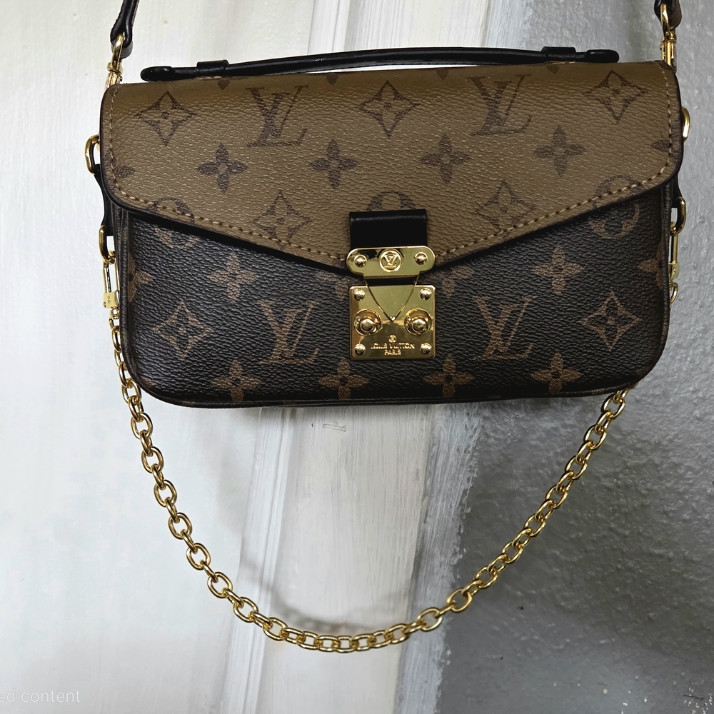 Louis Vuitton Pochette Métis East West Reverse Monogram Canvas